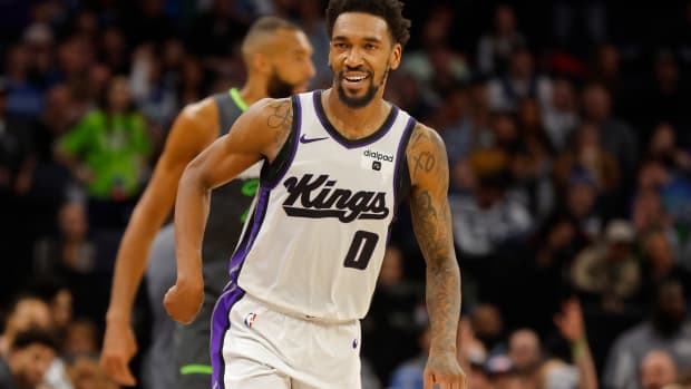 Mar 1, 2024; Minneapolis, Minnesota, USA; Sacramento Kings guard Malik Monk (0) celebrates his three-point basket against the Minnesota Timberwolves in overtime at Target Center. Mandatory Credit: Bruce Kluckhohn-USA TODAY Sports